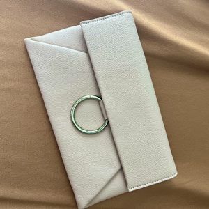 Cream color crossbody handbag.